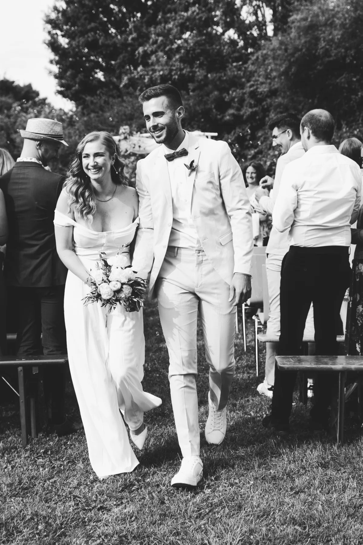 Newlyweds leaving their outdoor ceremony